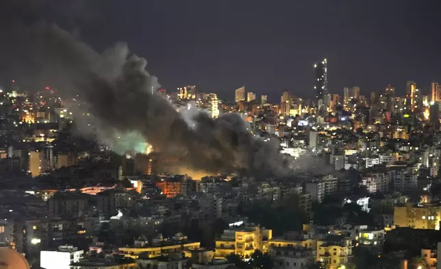 Smoke rises from Israeli airstrikes on Dahiyeh, in the southern suburb of Beirut, Lebanon, early Sunday, Oct. 20, 2024. (AP Photo/Hussein Malla)