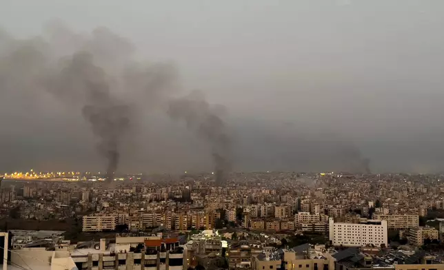 Smoke rise from Israeli airstrikes in Dahiyeh, Beirut, Lebanon, early Sunday, Oct. 6, 2024. (AP Photo/Hussein Malla)