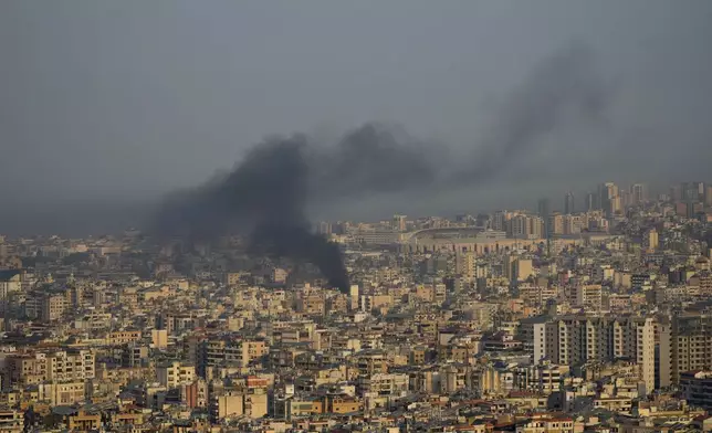 Smoke rise from Israeli airstrikes on Dahiyeh, Beirut's southern suburbs, Lebanon, Wednesday, Oct. 16, 2024. (AP Photo/Hussein Malla)