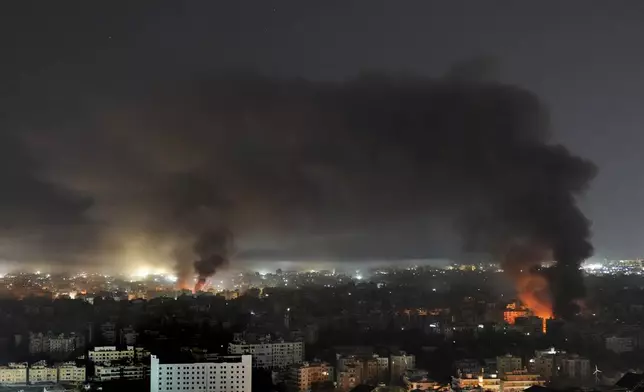 Flame and smoke rises from Israeli airstrikes on Dahiyeh, in the southern suburb of Beirut, Lebanon, early Sunday, Oct. 27, 2024. (AP Photo/Hussein Malla)