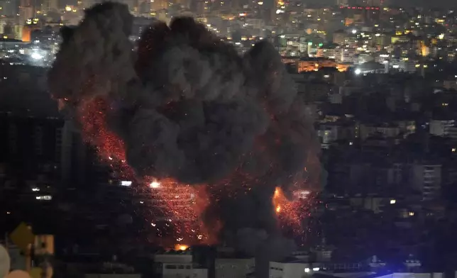 Flame and smoke rises from an Israeli airstrike on Dahiyeh, in the southern suburb of Beirut, Lebanon, early Sunday, Oct. 27, 2024. (AP Photo/Hussein Malla)