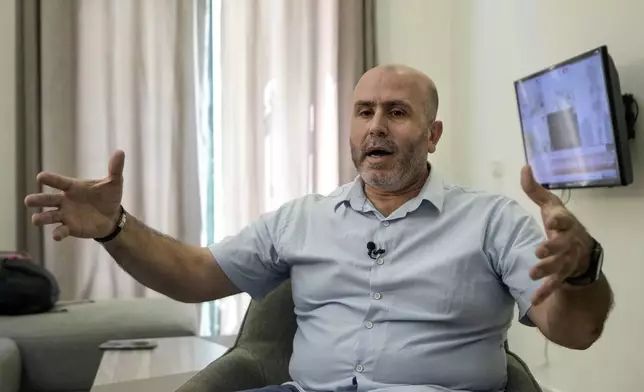 Ayman Jaber speaks during an interview with The Associated Press at his house in Aramoun village, southeast of Beirut, Lebanon, Saturday, Oct. 26, 2024. (AP Photo/Bilal Hussein)