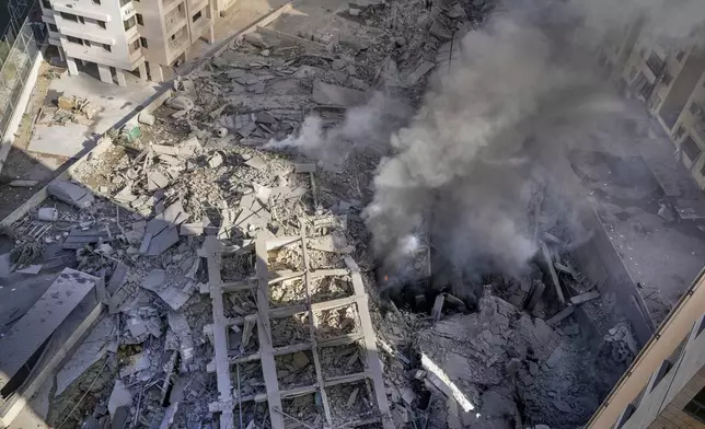 FILE - Smoke rises from the site of an Israeli airstrike in the sourthern suburbs of Beirut's southern suburbs in Lebanon, Wednesday, Oct. 2, 2024. (AP Photo/Hassan Ammar, File)