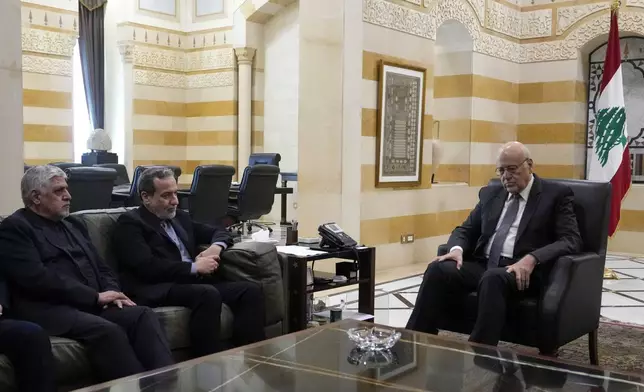 Iranian Foreign Minister Abbas Araghchi, second left, meets with Lebanese caretaker Prime Minister Najib Mikati, right, in Beirut, Lebanon, Friday, Oct. 4, 2024. (AP Photo/Hassan Ammar)