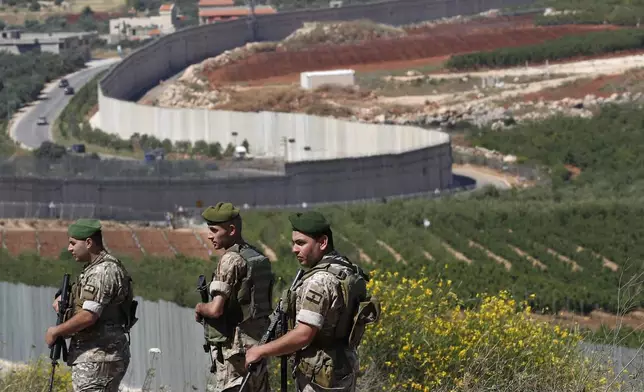 File - Lebanese army soldiers deploy at the Lebanese side of the Lebanese-Israeli border in the southern village of Kfar Kila, Lebanon, Saturday, May 15, 2021. (AP Photo/Hussein Malla, File)