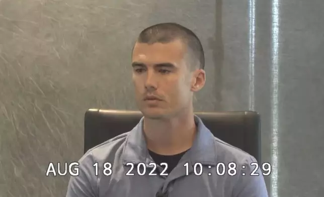 In this image from U.S. District Court, southern district of Indiana deposition video, Evansville Police Officer Trevor Koontz is questioned about the death of Edward Snukis in Evansville, Ind., on Aug. 18, 2022. (AP Photo)