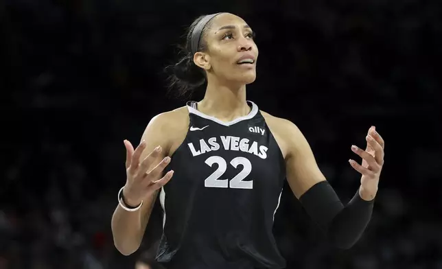 Las Vegas Aces center A'ja Wilson reacts after her team is called for a foul during the second half of a WNBA Semifinal basketball game against the New York Liberty, Sunday, Oct. 6, 2024, in Las Vegas. (AP Photo/Ian Maule)
