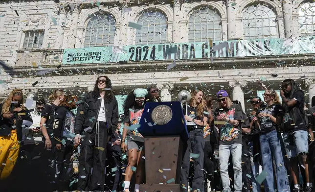 The New York Liberty, their supporters, local officials and others celebrate during a ceremony after a parade in honor of the Liberty's WNBA basketball championship at City Hall in New York, Thursday, Oct. 24, 2024. (AP Photo/Seth Wenig)