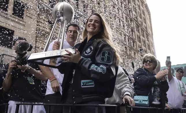 Sabrina Ionescu holds the WNBA basketball championship trophy during the New York Liberty's parade Thursday, Oct. 24, 2024, in New York. (AP Photo/Yuki Iwamura)