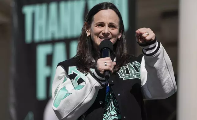 New York Liberty head coach Sandy Brondello speaks during a ceremony after a parade in honor of the Liberty's WNBA basketball championship at City Hall in New York, Thursday, Oct. 24, 2024. (AP Photo/Seth Wenig)