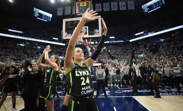 Minnesota Lynx forward Napheesa Collier (24) celebrates their victory over the New York Liberty after Game 4 of a WNBA basketball final playoff series, Friday, Oct. 18, 2024, in Minneapolis. The Lynx won 82-80, forcing a Game 5 in the series. (AP Photo/Abbie Parr)