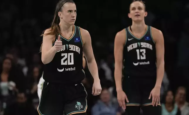 New York Liberty guard Sabrina Ionescu (20) reacts in overtime of Game 5 of the WNBA basketball final series against the Minnesota Lynx, Sunday, Oct. 20, 2024, in New York. (AP Photo/Pamela Smith)