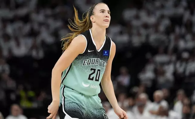 New York Liberty guard Sabrina Ionescu reacts after missing a shot during the first half against the Minnesota Lynx in Game 3 of a WNBA basketball final playoff series, Wednesday, Oct. 16, 2024, in Minneapolis. (AP Photo/Abbie Parr)