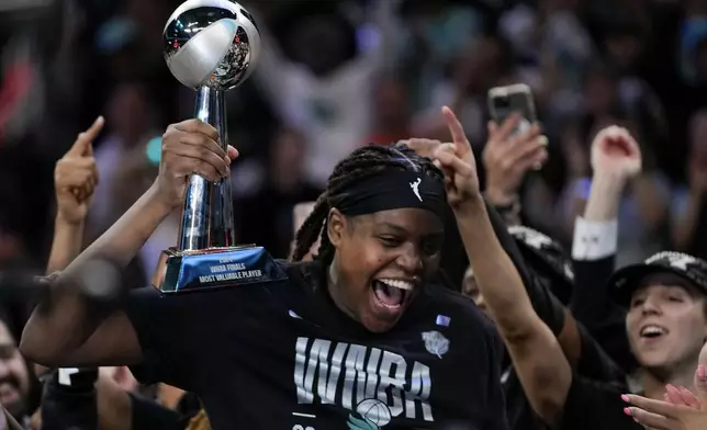 New York Liberty forward Jonquel Jones (35) reacts after being given the MVP Award after winning the championship against the Minnesota Lynx in Game 5 of the WNBA basketball final series, Sunday, Oct. 20, 2024, in New York. (AP Photo/Pamela Smith)