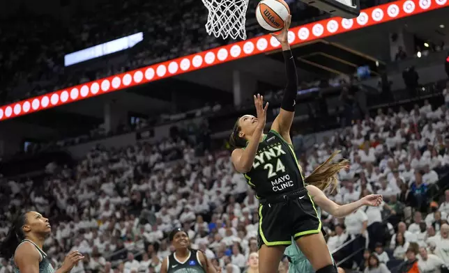 Minnesota Lynx forward Napheesa Collier (24) drives to the basket during the second half against the New York Liberty in Game 3 of a WNBA basketball final playoff series, Wednesday, Oct. 16, 2024, in Minneapolis. (AP Photo/Abbie Parr)