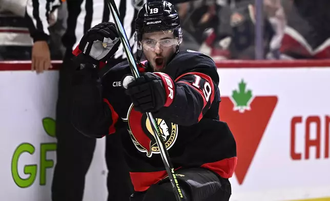 Ottawa Senators right wing Drake Batherson (19) celebrates his goal against the Tampa Bay Lightning during second period NHL hockey action in Ottawa, on Saturday, Oct. 19, 2024. (Justin Tang/The Canadian Press via AP)