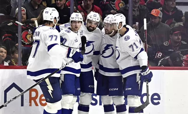 Tampa Bay Lightning left wing Nicholas Paul (20) celebrates a goal against the Ottawa Senators during the second period of an NHL hockey game in Ottawa, Saturday, Oct. 19, 2024. (Justin Tang/The Canadian Press via AP)