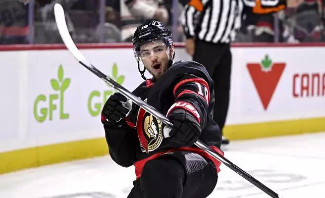 Ottawa Senators right wing Drake Batherson (19) celebrates a goal against the Tampa Bay Lightning during the second period of an NHL hockey game in Ottawa, Saturday, Oct. 19, 2024. (Justin Tang/The Canadian Press via AP)