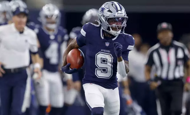 Dallas Cowboys wide receiver KaVontae Turpin (9) returns a punt in the first half of an NFL football game against the Detroit Lions in Arlington, Texas, Sunday, Oct. 13, 2024. (AP Photo/Gareth Patterson)