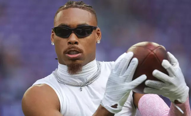 Minnesota Vikings wide receiver Justin Jefferson catches a pass before an NFL football game against the Detroit Lions Sunday, Oct. 20, 2024, in Minneapolis. (AP Photo/Bruce Kluckhohn)