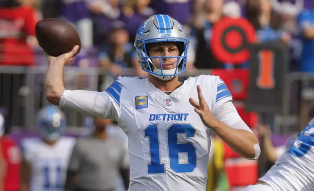 Detroit Lions quarterback Jared Goff (16) throws against the Minnesota Vikings during the first half of an NFL football game Sunday, Oct. 20, 2024, in Minneapolis. (AP Photo/Bruce Kluckhohn)