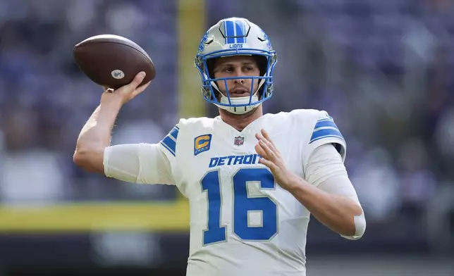 Detroit Lions quarterback Jared Goff throws during warmups before an NFL football game against the Minnesota Vikings Sunday, Oct. 20, 2024, in Minneapolis. (AP Photo/Abbie Parr)