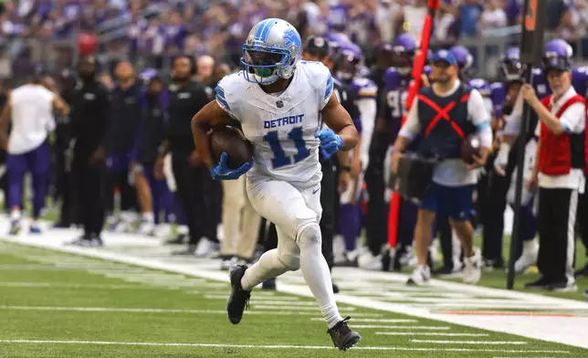 Detroit Lions wide receiver Kalif Raymond (11) catches a 21-yard touchdown pass against the Minnesota Vikings during the second half of an NFL football game Sunday, Oct. 20, 2024, in Minneapolis. (AP Photo/Bruce Kluckhohn)