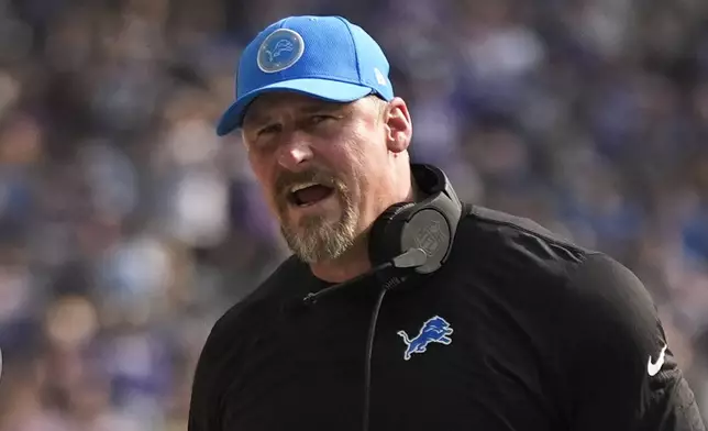 Detroit Lions head coach Dan Campbell watches against the Minnesota Vikings during the first half of an NFL football game Sunday, Oct. 20, 2024, in Minneapolis. (AP Photo/Abbie Parr)