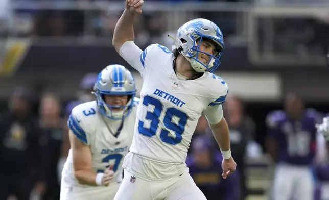 Detroit Lions place-kicker Jake Bates (39) celebrates his 44-yard field goal against the Minnesota Vikings during the second half of an NFL football game Sunday, Oct. 20, 2024, in Minneapolis. (AP Photo/Abbie Parr)