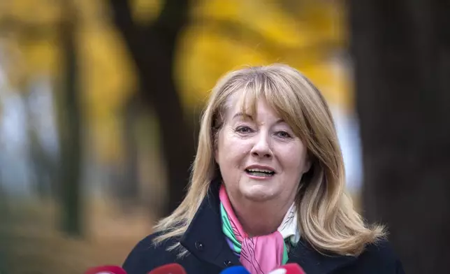 Leader of the Social Democratic Party Vilija Blinkeviciute speaks to the press at a polling station during a second round of voting in parliamentary election, in Vilnius, Lithuania, Sunday, Oct. 27, 2024. (AP Photo/Mindaugas Kulbis)