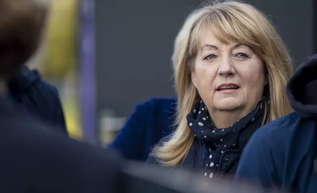 Leader of the Social Democratic Party Vilija Blinkeviciute arrives at a polling station during the advance parliamentary elections in Vilnius, Lithuania, Wednesday, Oct. 9, 2024. (AP Photo/Mindaugas Kulbis)