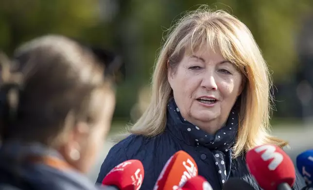 Leader of the Social Democratic Party Vilija Blinkeviciute speaks to the press at a polling station during the advance parliamentary elections in Vilnius, Lithuania, Wednesday, Oct. 9, 2024. (AP Photo/Mindaugas Kulbis)