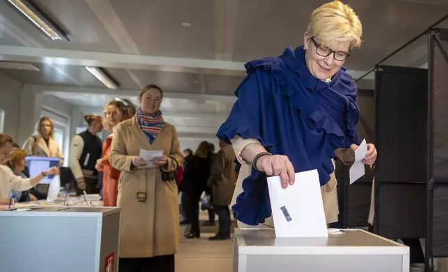 FILE - Lithuania's Prime Minister Ingrida Simonyte, a presidential candidate, casts her vote at a polling station during the advance presidential elections in Vilnius, Lithuania, Thursday, May 9, 2024. (AP Photo/Mindaugas Kulbis, File)