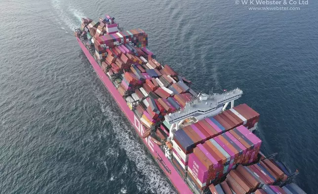 This image provided by W K Webster shows dislodged containers on the cargo ship ONE Apus at Osaka Bay, Japan, on Dec. 7, 2020, after the ship hit heavy swells on a voyage from China to California in November 2020. (W K Webster via AP)