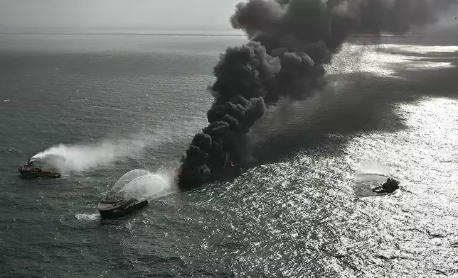 FILE - In this photo provided by Sri Lanka Air Force, smoke rises from the container vessel X-Press Pearl engulfed in flames off Colombo port, Sri Lanka, Wednesday, May 26, 2021. (Sri Lanka Air Force via AP, File)