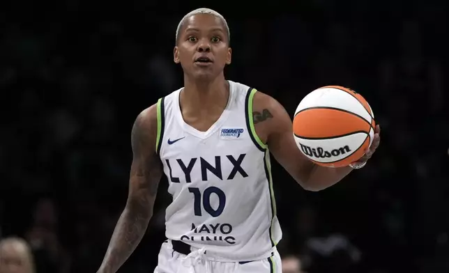 Minnesota Lynx's Courtney Williams dribbles during the second half in Game 1 of a WNBA basketball final playoff series against the New York Liberty, Thursday, Oct. 10, 2024, in New York. (AP Photo/Pamela Smith)