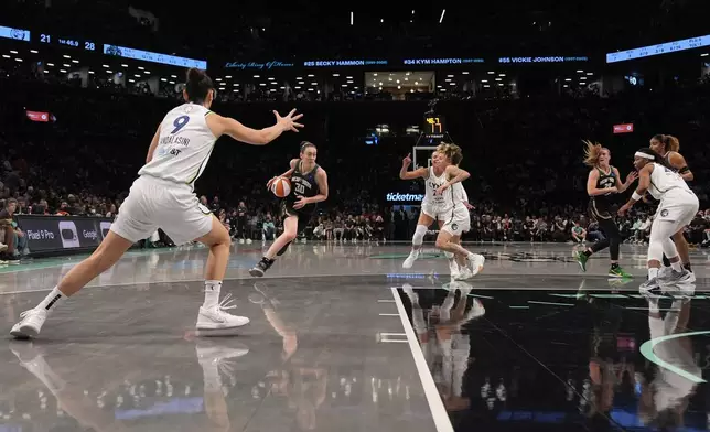 New York Liberty's Breanna Stewart (30) dribbles during the first half in Game 2 of a WNBA basketball final playoff series against the Minnesota Lynx, Sunday, Oct. 13, 2024, in New York. (AP Photo/Pamela Smith)