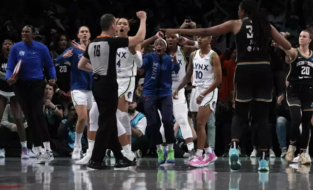 Players react after a foul is called in the last seconds of the second half in Game 1 of a WNBA basketball final playoff series between the New York Liberty and the Minnesota Lynx, Thursday, Oct. 10, 2024, in New York. (AP Photo/Pamela Smith)