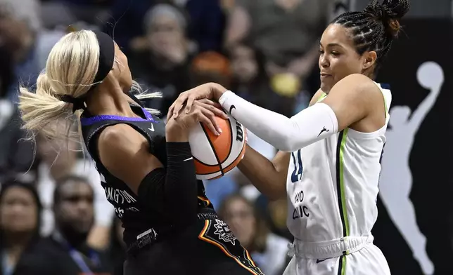 Minnesota Lynx forward Napheesa Collier pressures Connecticut Sun guard DiJonai Carrington, left, during the first half of a WNBA basketball semifinal game, Friday, Oct. 4, 2024, in Uncasville, Conn. (AP Photo/Jessica Hill)