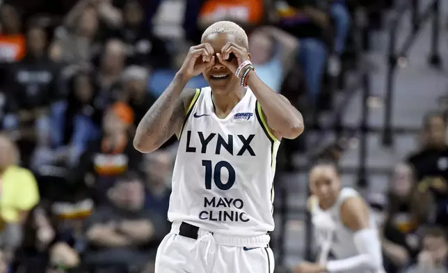 Minnesota Lynx guard Courtney Williams (10) gestures during the second half of a WNBA basketball semifinal game against the Connecticut Sun, Friday, Oct. 4, 2024, in Uncasville, Conn. (AP Photo/Jessica Hill)