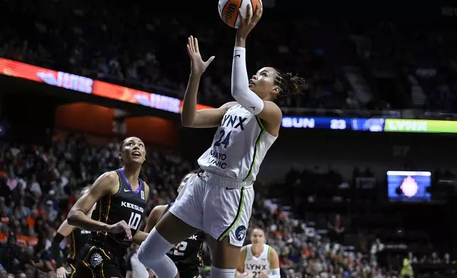 Minnesota Lynx forward Napheesa Collier (24) shoots as Connecticut Sun forward Olivia Nelson-Ododa (10) defends during the first half of a WNBA basketball semifinal game, Friday, Oct. 4, 2024, in Uncasville, Conn. (AP Photo/Jessica Hill)