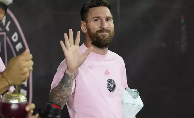 Inter Miami forward Lionel Messi waves as he arrives for match one of their MLS playoff opening round soccer match against Atlanta United, Friday, Oct. 25, 2024, in Fort Lauderdale, Fla. (AP Photo/Lynne Sladky)