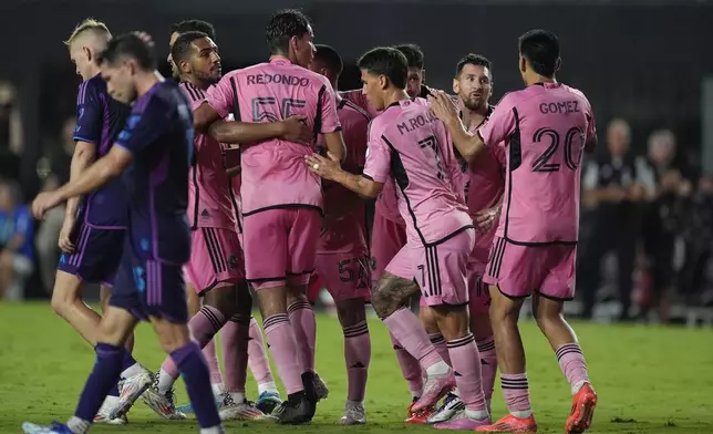 Inter Miami forward Lionel Messi, second right, celebrates with teammates after scoring against Charlotte FC during the second half of an MLS soccer match, Saturday, Sept. 28, 2024, in Fort Lauderdale, Fla. (AP Photo/Rebecca Blackwell)