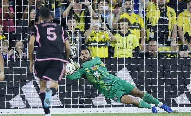 Inter Miami's Drake Callender makes a save on a Columbus Crew penalty kick during the second half of an MLS soccer match, Wednesday, Oct. 2, 2024, in Columbus, Ohio. (AP Photo/Jay LaPrete)