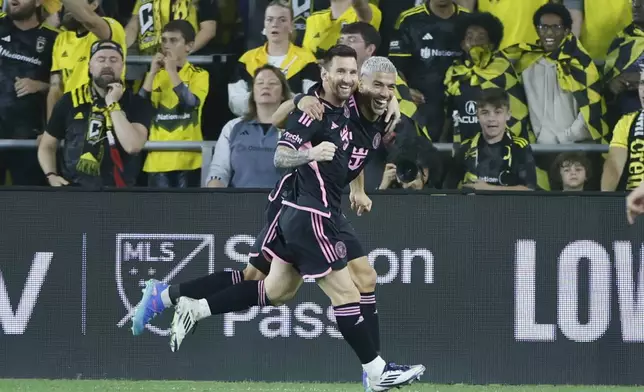 Inter Miami's Lionel Messi, left, and Luis Suarez celebrate their goal against the Columbus Crew during the second half of an MLS soccer match, Wednesday, Oct. 2, 2024, in Columbus, Ohio. (AP Photo/Jay LaPrete)