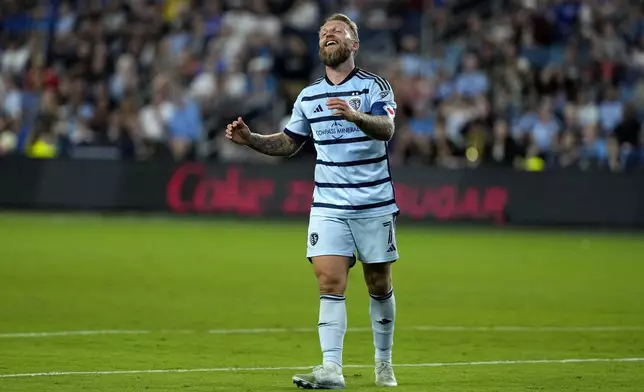 Sporting Kansas City attacker Johnny Russell reacts after missing a goal attempt during the first half of an MLS soccer match against Los Angeles FC Saturday, Oct. 5, 2024, in Kansas City, Kan. (AP Photo/Charlie Riedel)