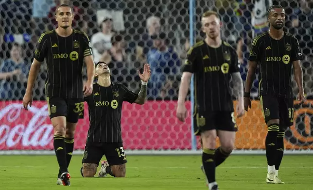 Los Angeles FC attacker Cristian Olivera (13) celebrates after scoring a goal during the first half of an MLS soccer match against Sporting Kansas City Saturday, Oct. 5, 2024, in Kansas City, Kan. (AP Photo/Charlie Riedel)