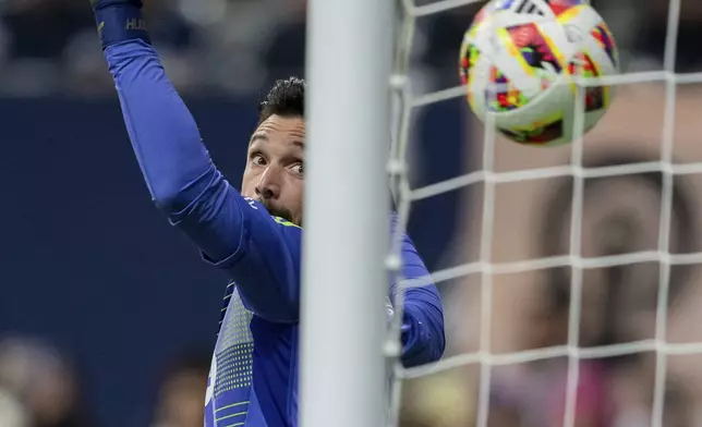 Los Angeles FC goalkeeper Hugo Lloris watches as the ball enters the net after the Vancouver Whitecaps score during second half MLS soccer action in Vancouver, British Columbia, Sunday, Oct. 13, 2024. (Ethan Cairns/The Canadian Press via AP)