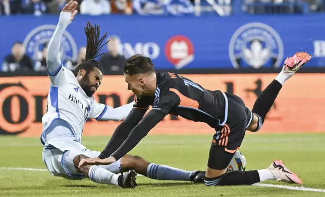 CF Montreal's Raheem Edwards, left, challenges New York City FC's Hannes Wolf during first half MLS soccer action in Montreal, Saturday, October 19, 2024. (Graham Hughes/The Canadian Press via AP)