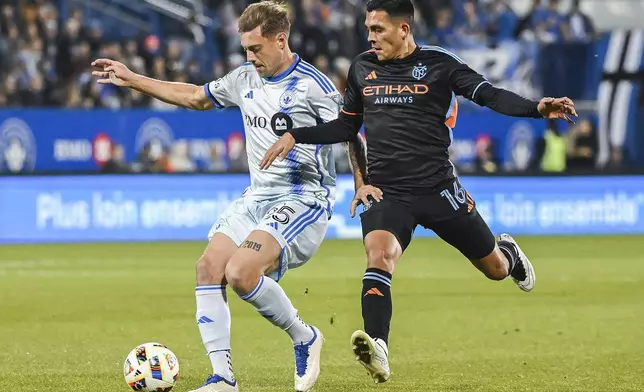 CF Montreal's Gabriele Corbo, left, defends against New York City FC's Alonso Martínez (16) during first half MLS soccer action in Montreal, Saturday, October 19, 2024. (Graham Hughes/The Canadian Press via AP)